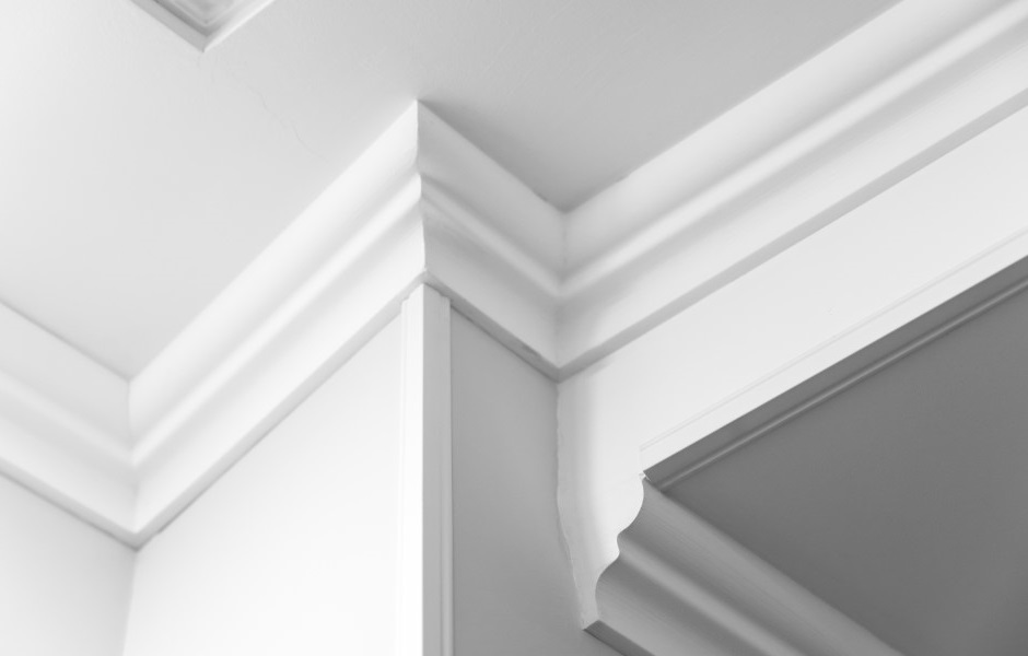 Image of a ceiling and trim in white, featuring white step crown molding.
