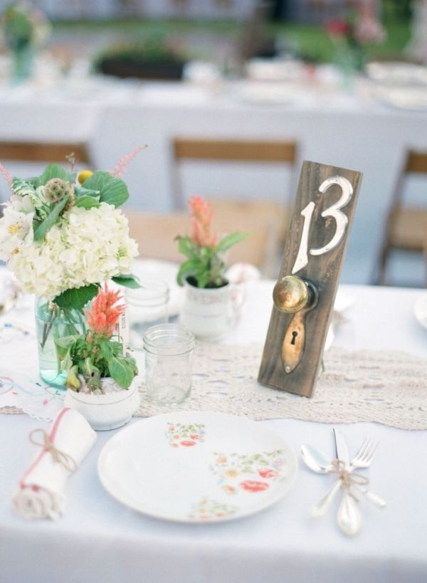 If you're planning a rustic or chic wedding, consider using antique or vintage door knobs as table numbers.
