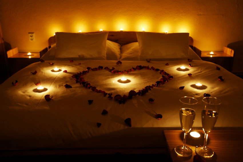 The way these discreet candles are placed on the bed and in the bedroom is almost mathematically thought. But the heart in the center dissipates all reason. Image Source: Pinterest