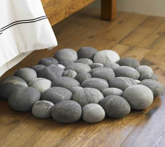 You can use pebbles to make a mat to put next to your bed so when you wake up in the morning, your feet get a little massage as you get out of bed.