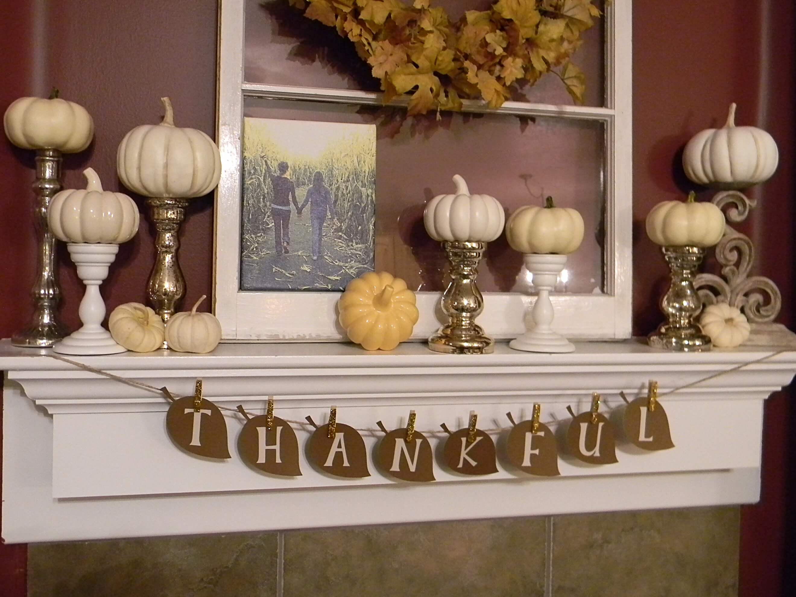 Fireplace mantel decor in the form of white pumpkins everywhere