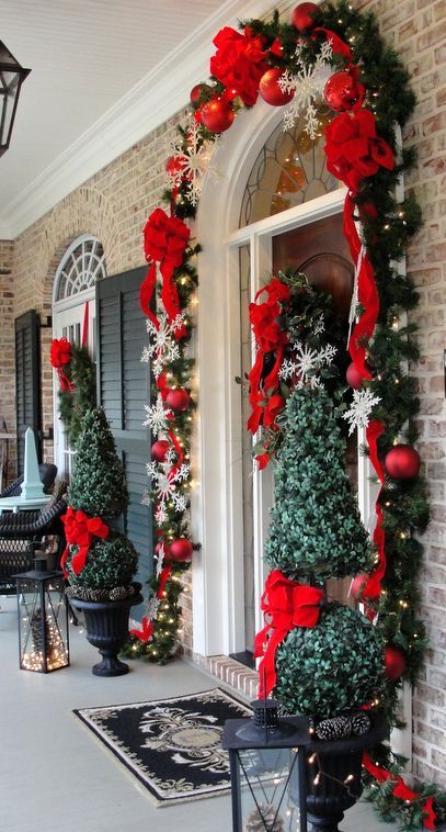Red and green are the quintessential colors for the holidays, so use them on your front porch to welcome your guests!