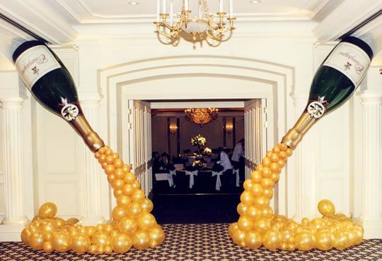 These giant, inflatable champagne bottle balloons are perfect for a New Year's Eve party!
