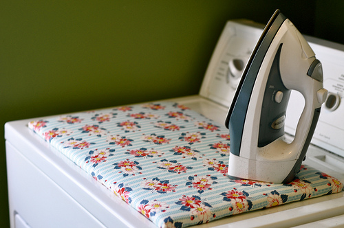 This ironing board fits on the top of the drier.