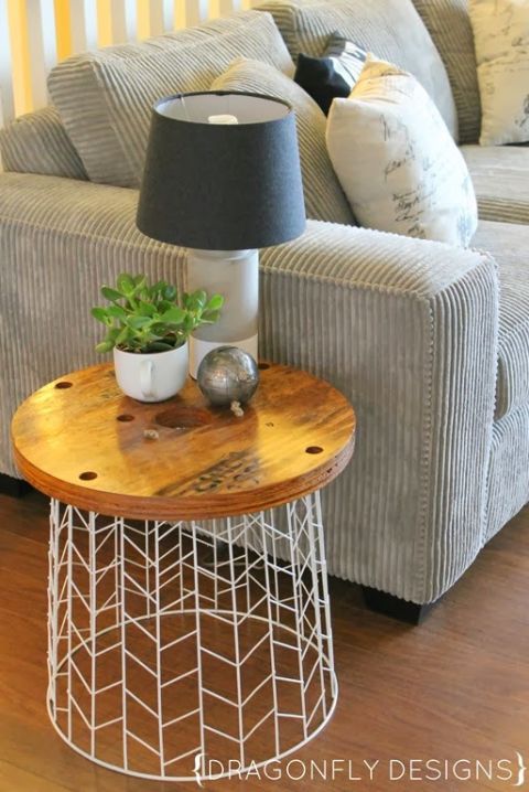 Flip a laundry basket and turn it into this cool table for lamp. Image Source: Good Housekeeping