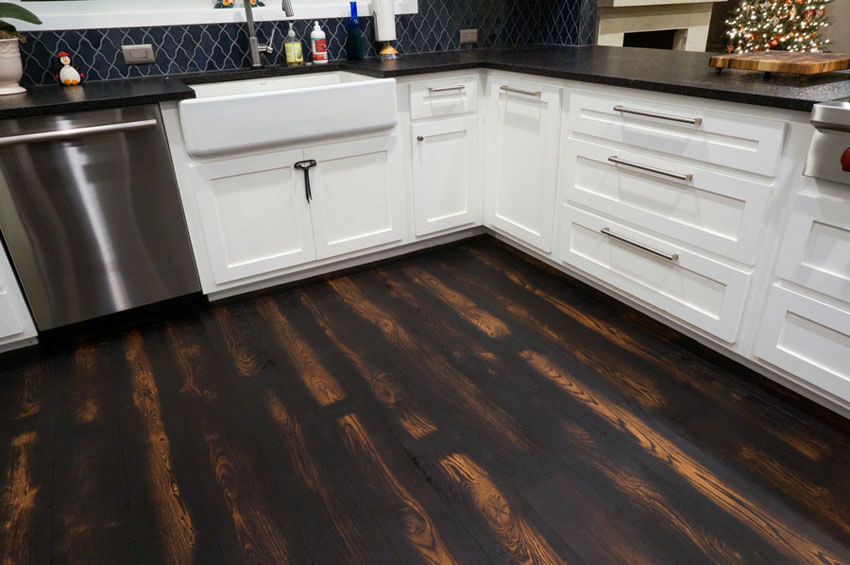 Burned wood flooring is perfect for the kitchen.