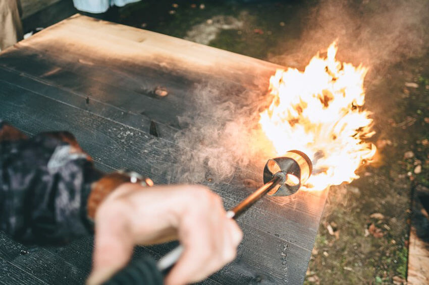 Burned wood flooring is handmade.