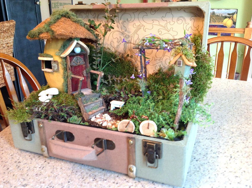 If you have a vintage suitcase lying around, use it to make a fairy garden!