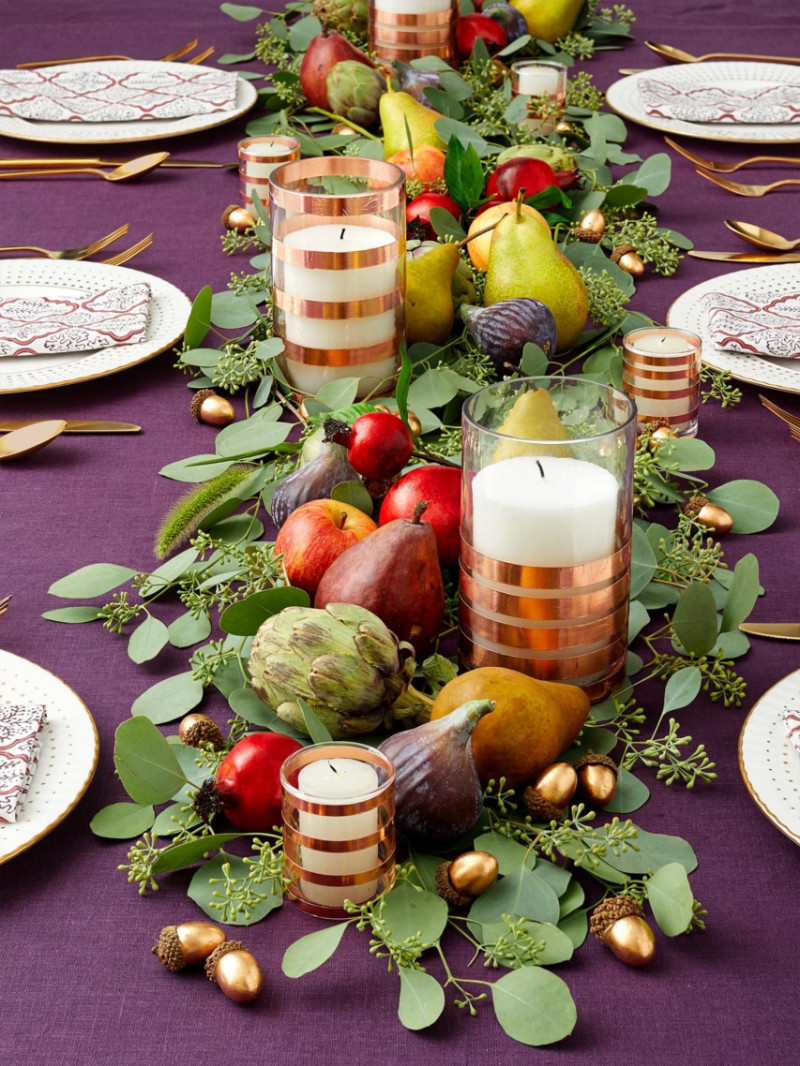 Gather some hours, fruits and greenery to create this centerpiece! Source: HGTV