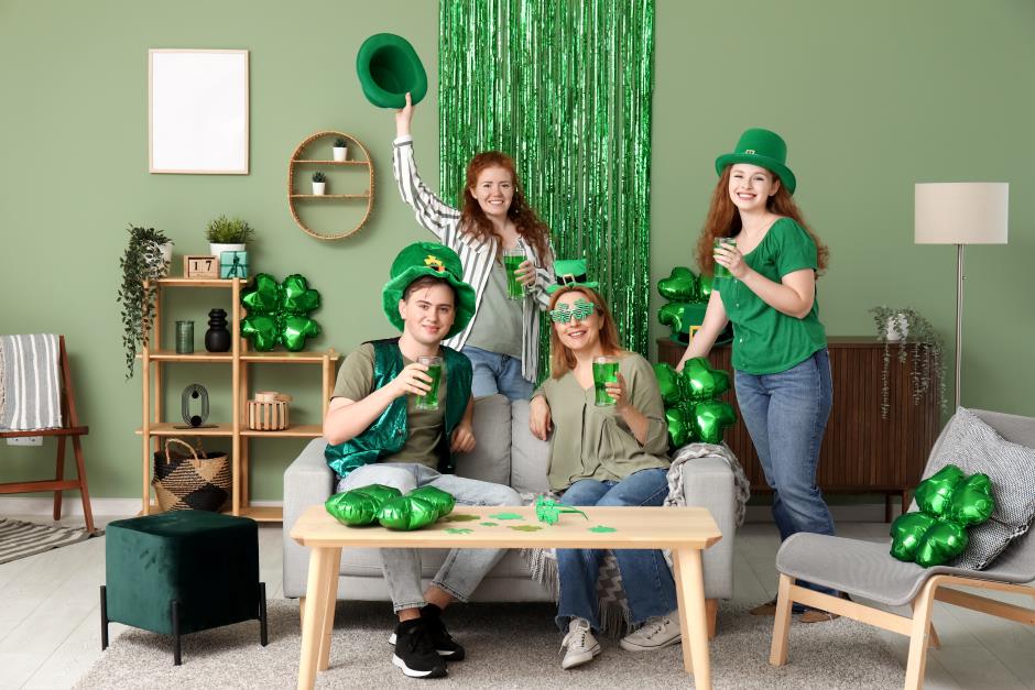 Group of people with green beer at home on st. patrick's day