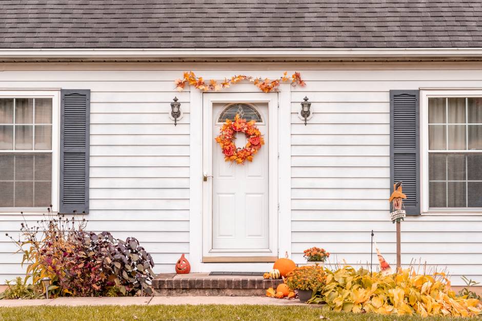 Front of the house with a door decorated in a thanksgiving theme