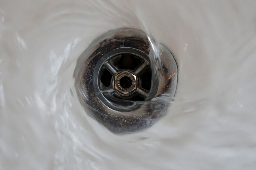 Pouring boiling water down your shower drain can help unclog it.